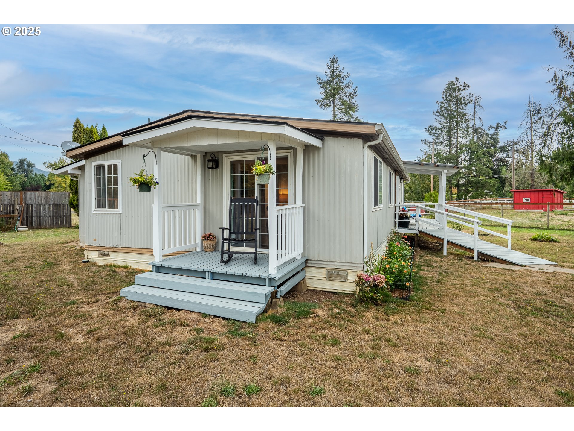 90948 Sunderman Road Springfield, OR 97478 - Photo 22 of 44 a view of a house with backyard and sitting area