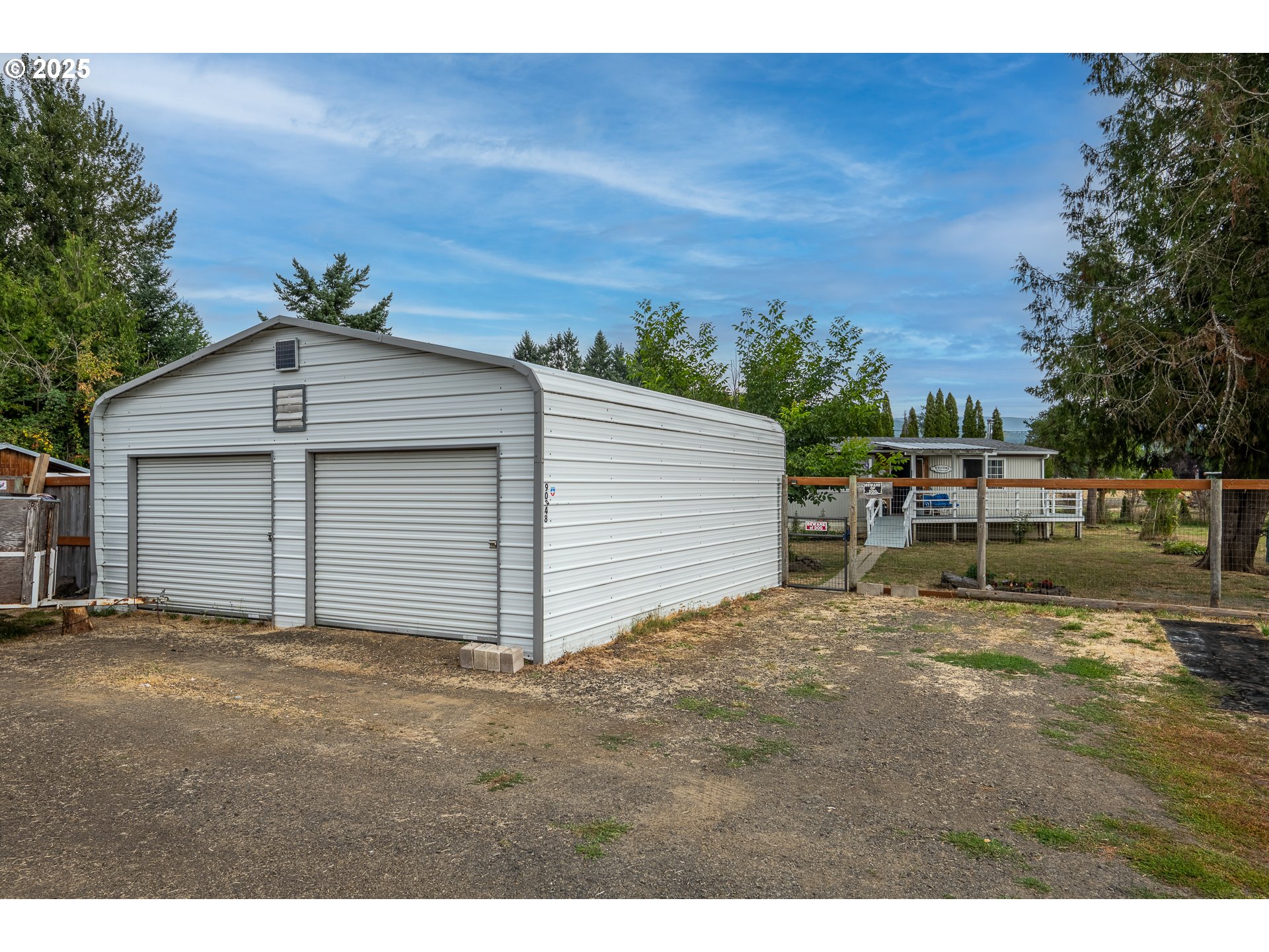90948 Sunderman Road Springfield, OR 97478 - Photo 26 of 44 a view of a house with backyard and trees