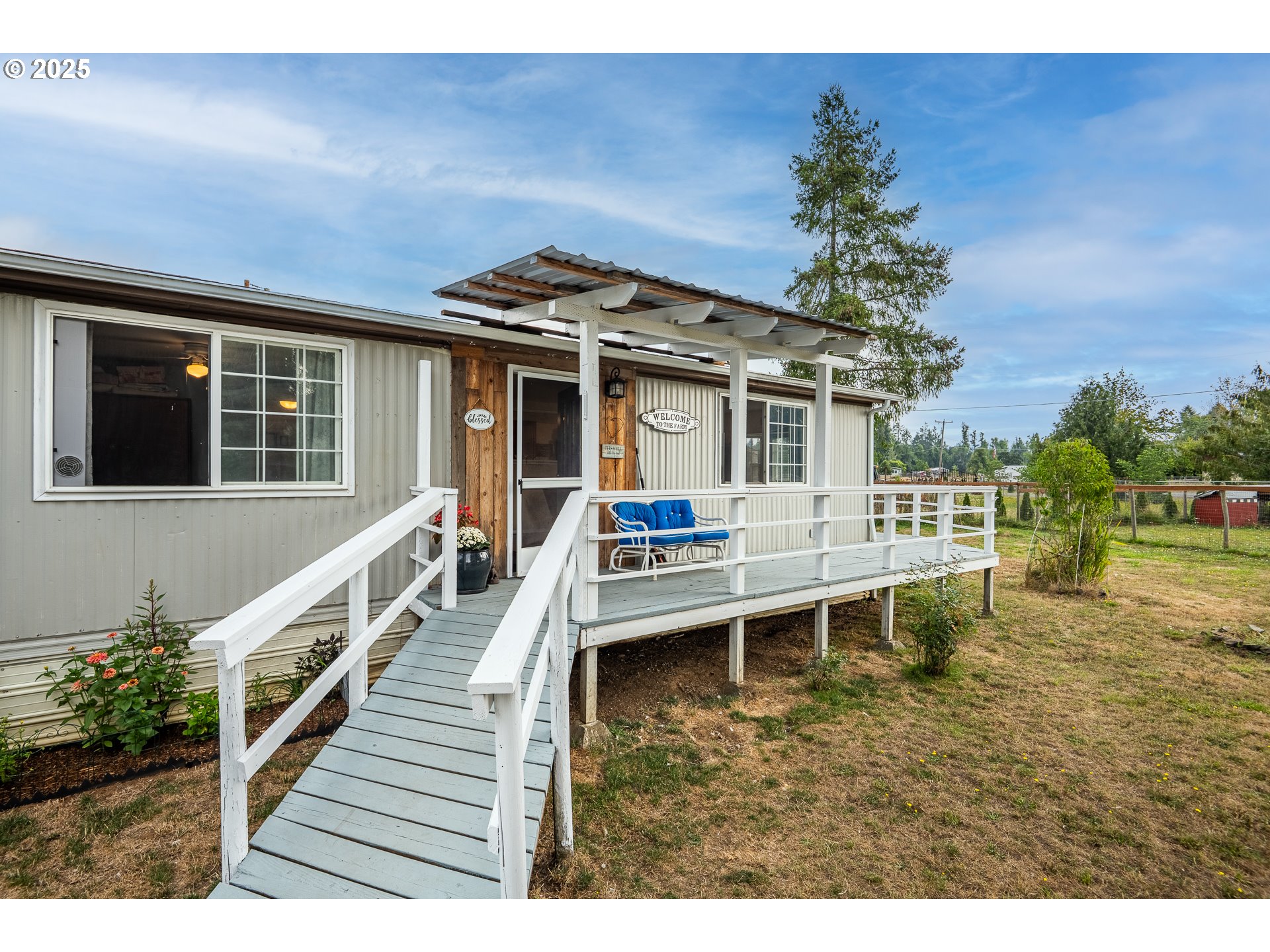 90948 Sunderman Road Springfield, OR 97478 - Photo 3 of 44 a view of a house with wooden deck