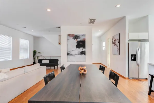 a kitchen with a sink cabinets and a large window
