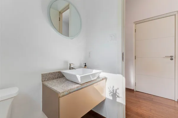 a bathroom with a sink a mirror and a bathtub