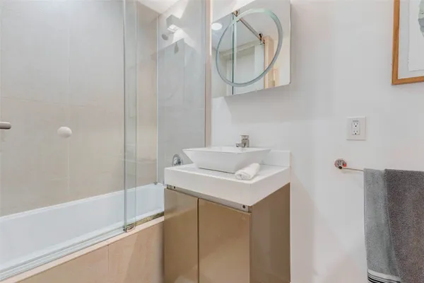 a bathroom with a sink and a mirror