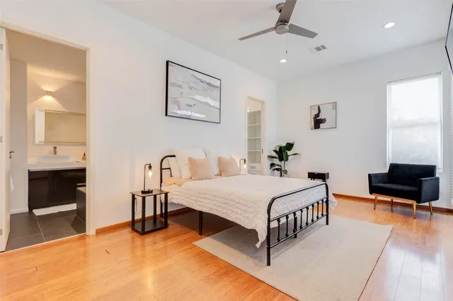a white toilet sitting next to a bathroom sink