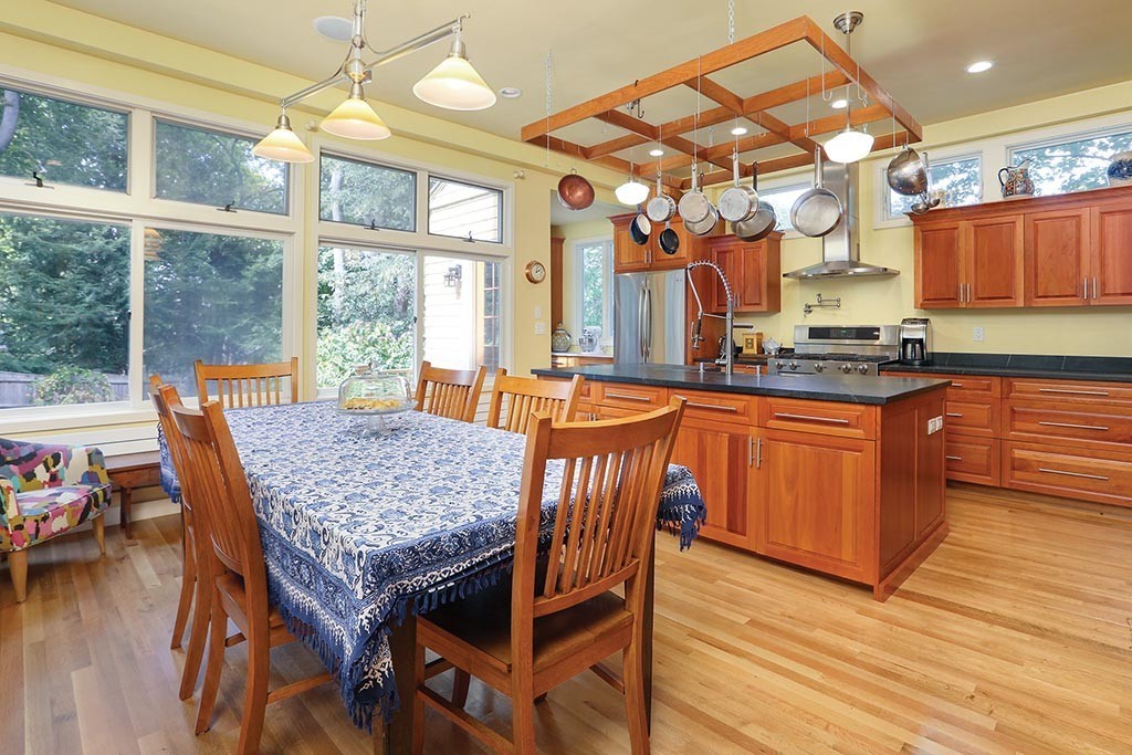 23 Philbrick Road Brookline, MA 02445 - Photo 4 of 10 a kitchen with a wooden table and chairs
