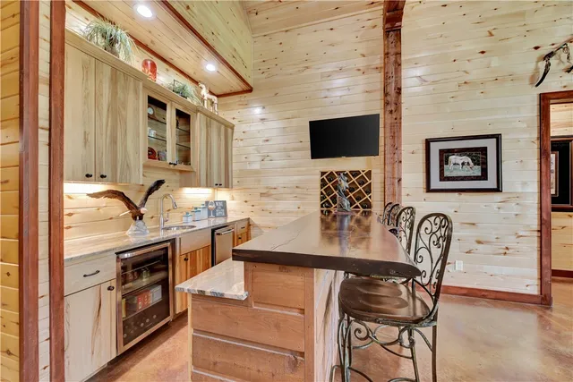a living room with lots of furniture and a rug
