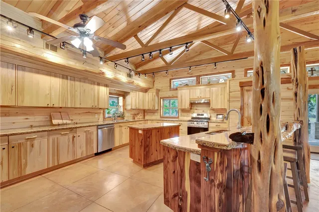 a kitchen with a stove cabinets and counter space