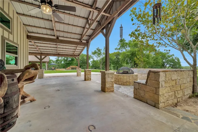 a view of a house with a porch and furniture