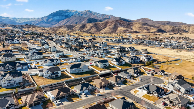 141 Wolverine Creek Elk Ridge, UT 84651 - Photo 47 of 47 Aerial perspective of suburban area with a mountain backdrop