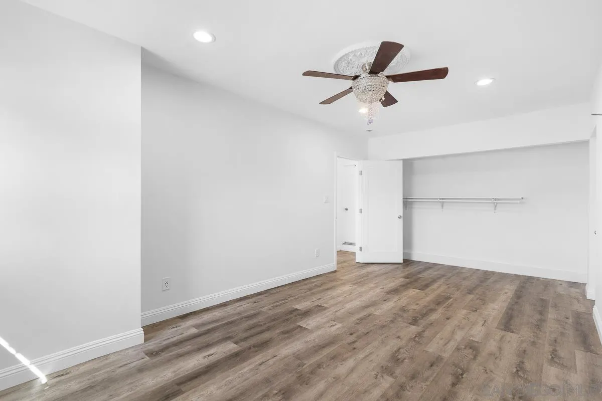 719 Mahogany Drive El Cajon, CA 92019 - Photo 15 of 30 a view of empty room with wooden floor and ceiling fan