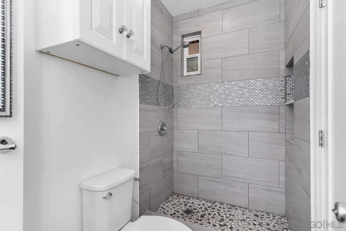 719 Mahogany Drive El Cajon, CA 92019 - Photo 18 of 30 a bathroom with a toilet and a shower