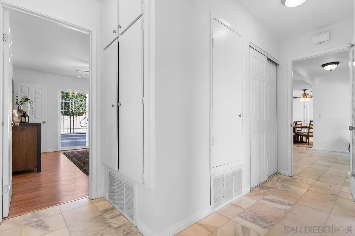 719 Mahogany Drive El Cajon, CA 92019 - Photo 20 of 30 a view of a hallway with wooden floor and a living room