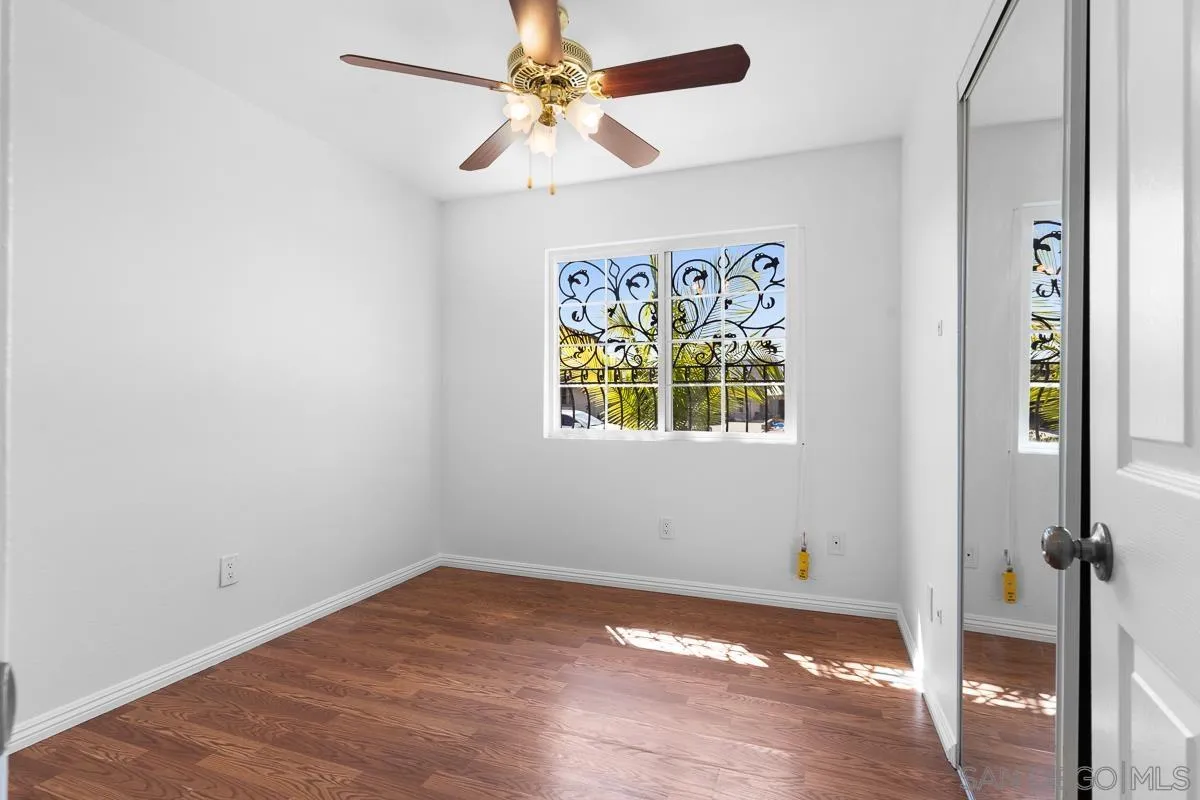 719 Mahogany Drive El Cajon, CA 92019 - Photo 21 of 30 an empty room with a window and a ceiling fan