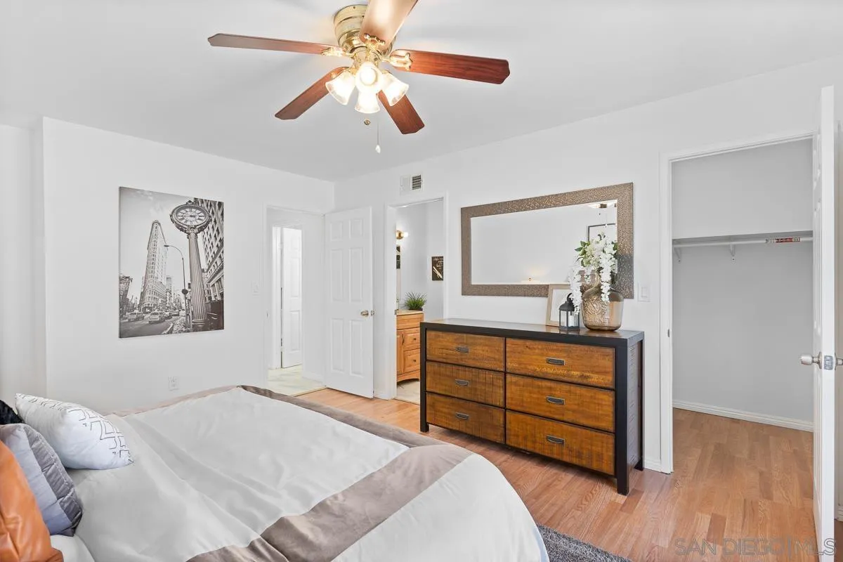 719 Mahogany Drive El Cajon, CA 92019 - Photo 25 of 30 a bedroom with a bed and a chandelier