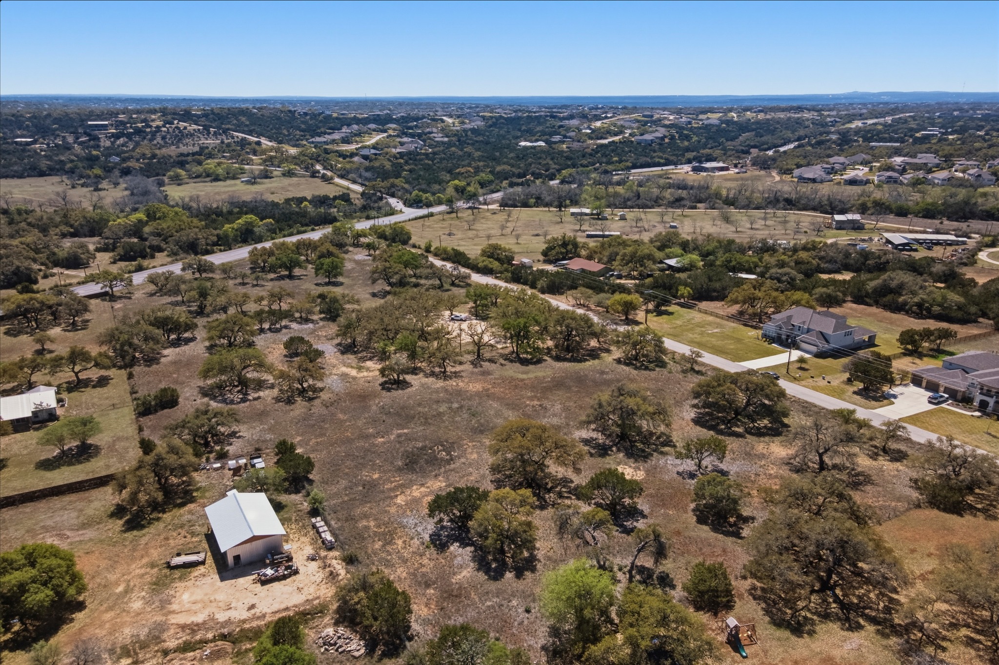 268 Kinnikinik Loop Austin, TX 78737 - Photo 15 of 32 an aerial view of residential house with parking space