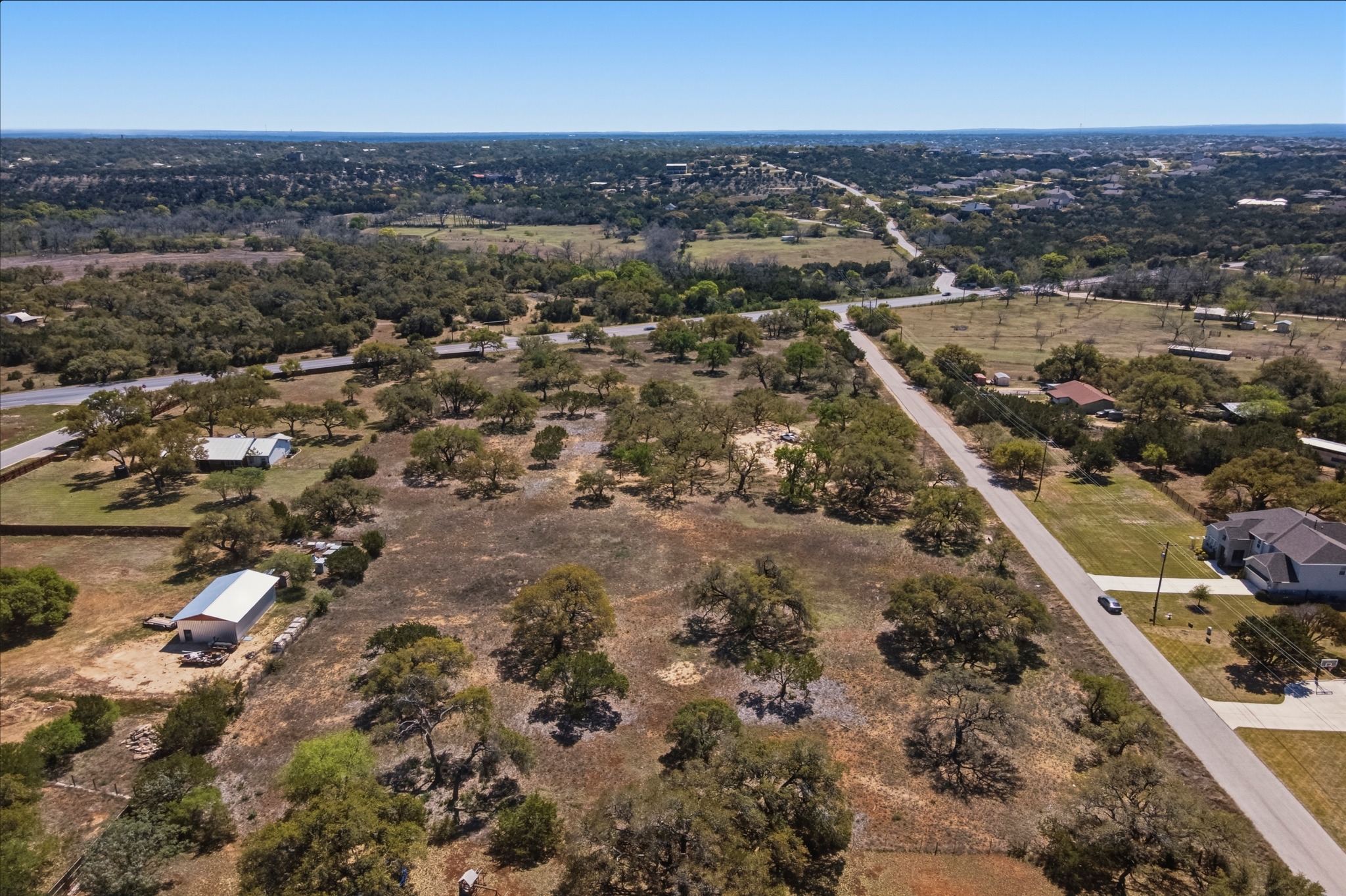 268 Kinnikinik Loop Austin, TX 78737 - Photo 16 of 32 an aerial view of a city