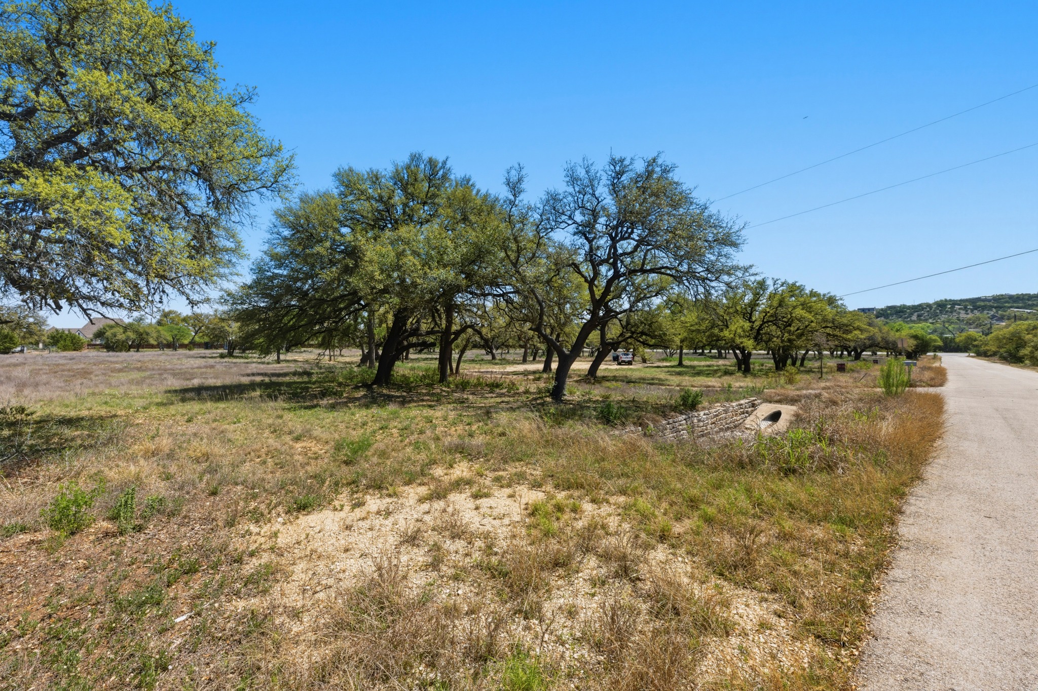 268 Kinnikinik Loop Austin, TX 78737 - Photo 31 of 32 a view of a lake with houses