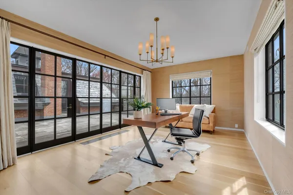 a view of a livingroom with furniture and a window