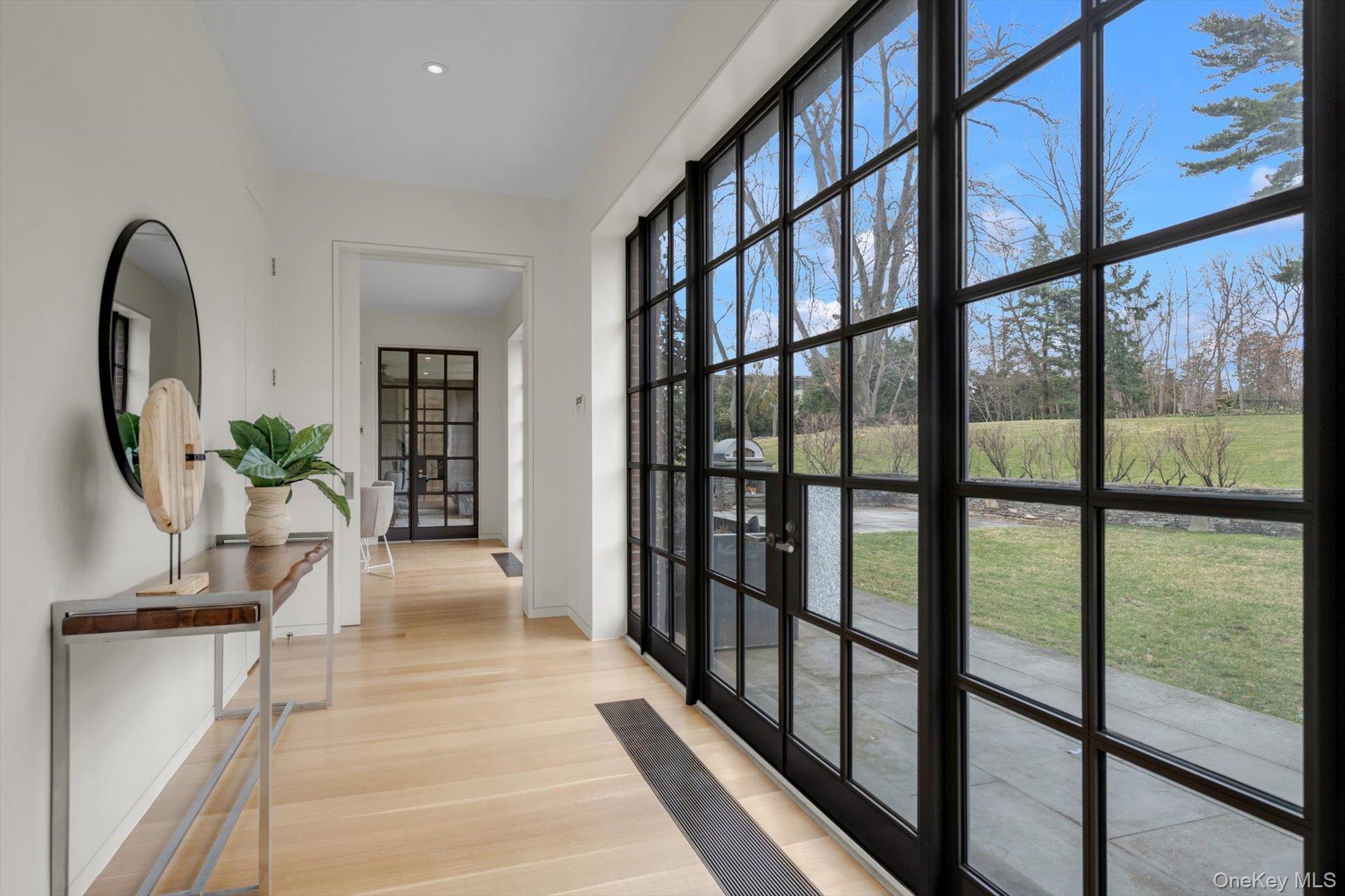 217 Sands Point Road Sands Point, NY 11050 - Photo 2 of 39 a view of staircase with a potted plant on a table