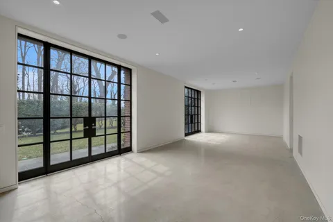 a view of a big room with windows
