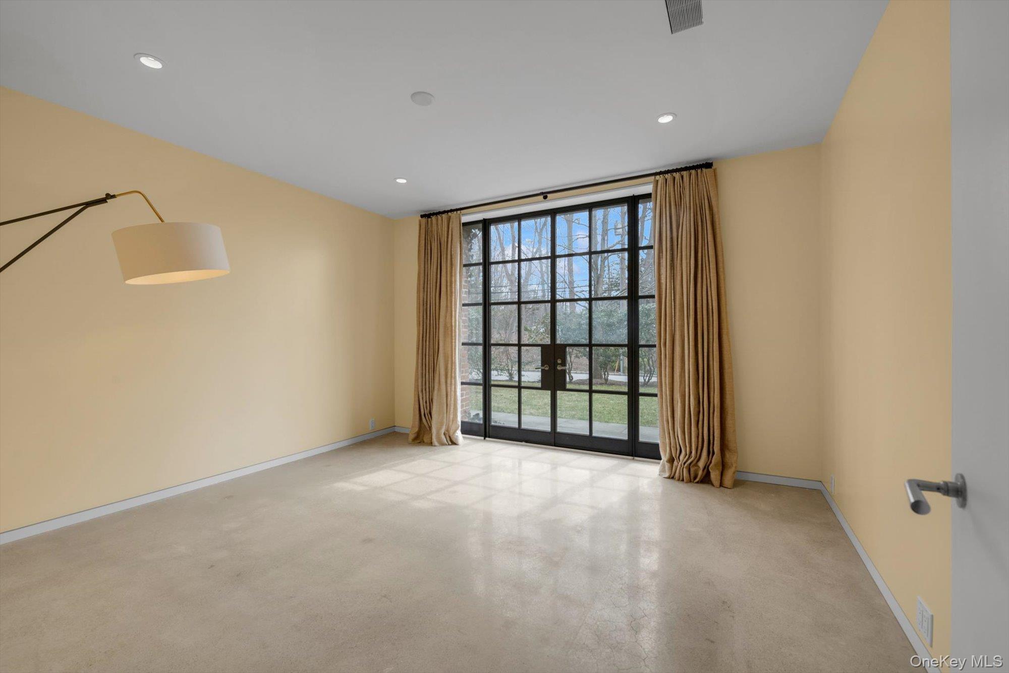 217 Sands Point Road Sands Point, NY 11050 - Photo 34 of 39 a view of an empty room with a window
