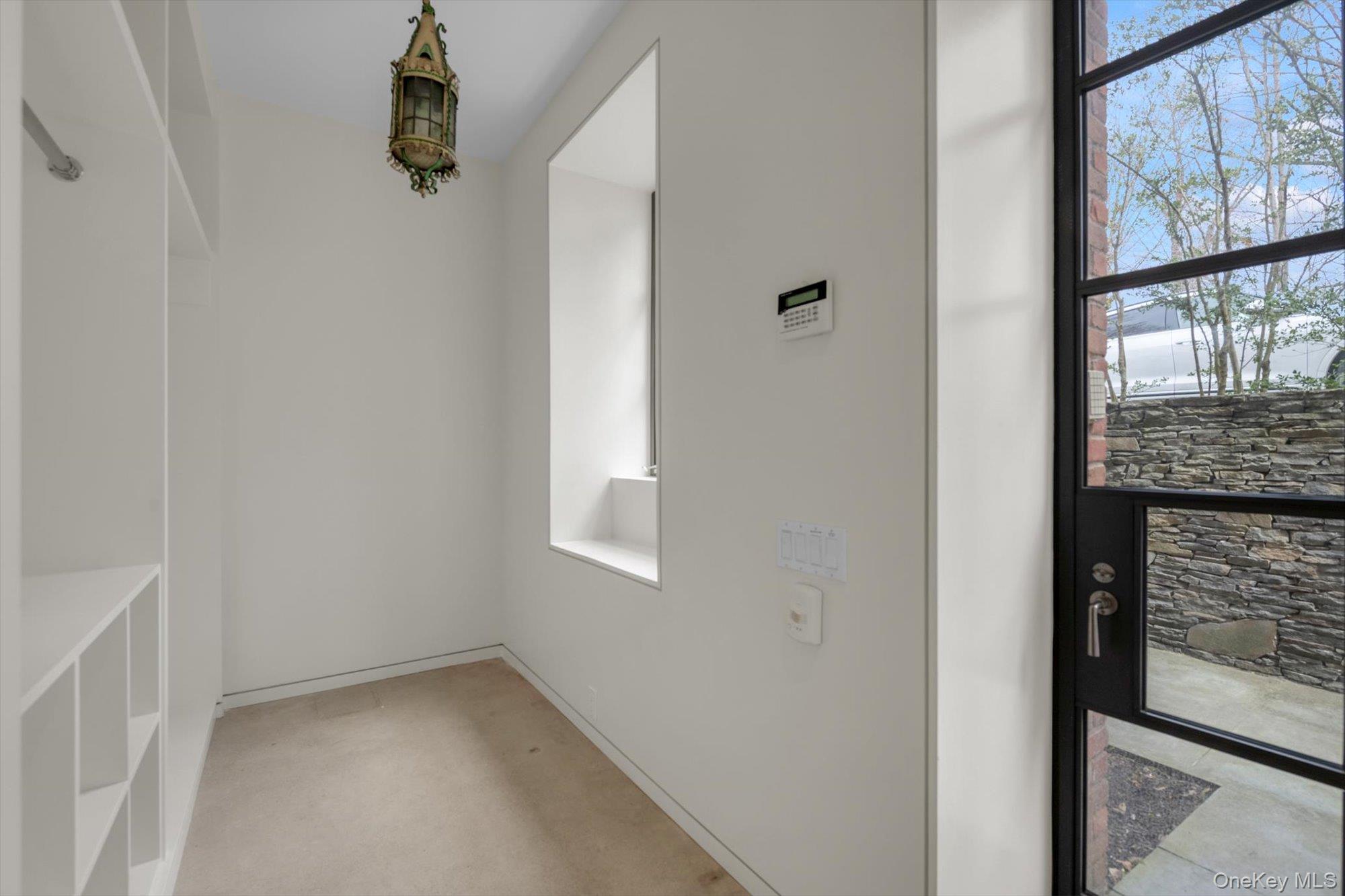 217 Sands Point Road Sands Point, NY 11050 - Photo 36 of 39 a view of an empty room with a window