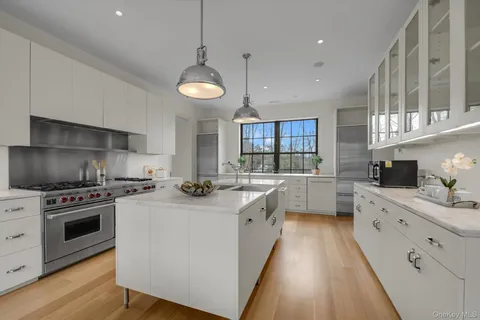 a kitchen with stove a sink and refrigerator