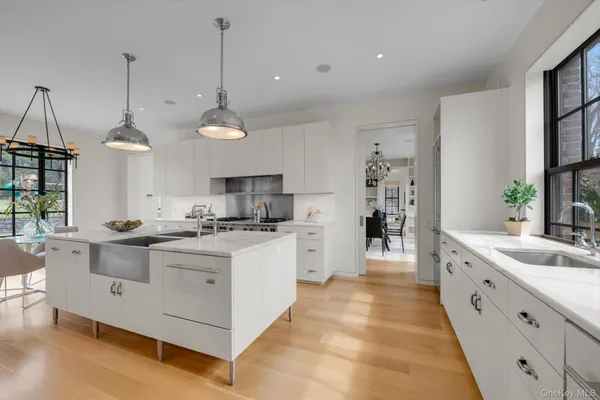 a kitchen with stainless steel appliances granite countertop a sink and stove