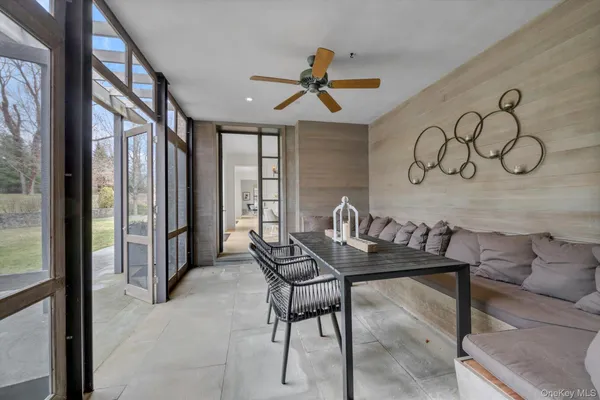 a view of a livingroom with furniture and window