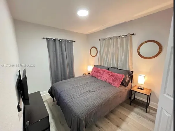 a bedroom with a bed and a closet