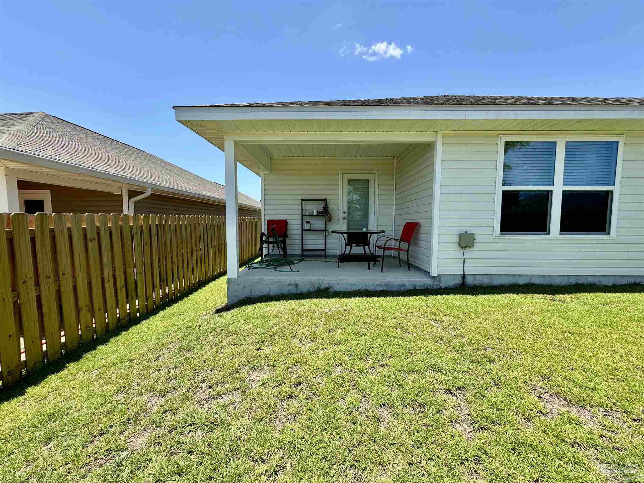 5645 Guinevere Lane Milton, FL 32583 - Photo 22 of 24 a view of a house with swimming pool in front of it