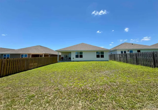 a front view of a house with yard