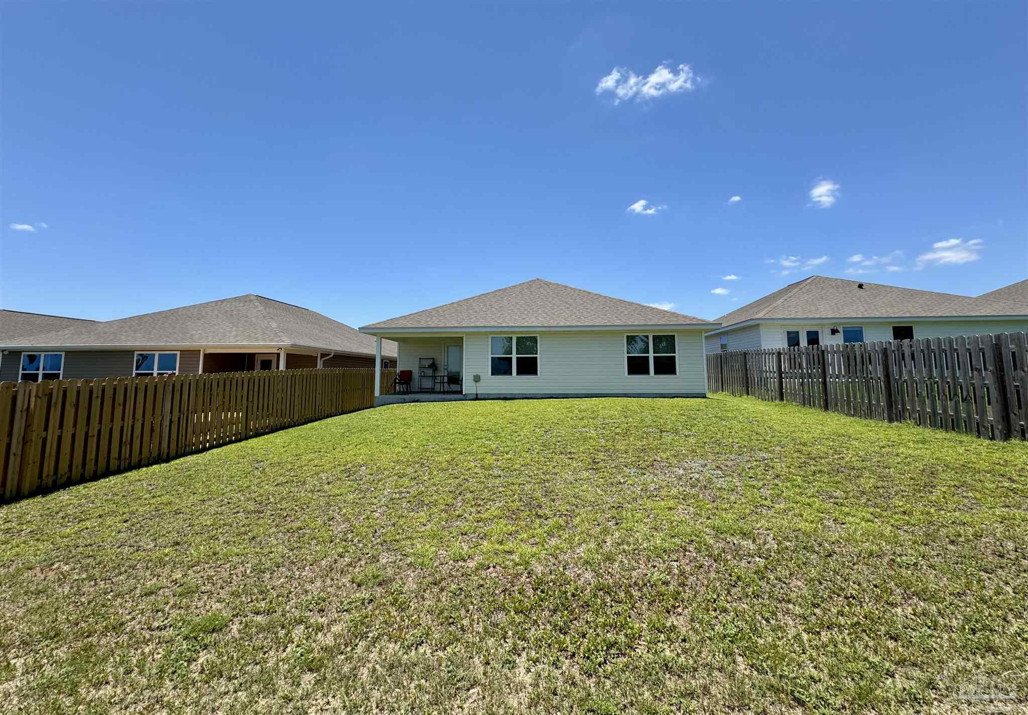 5645 Guinevere Lane Milton, FL 32583 - Photo 23 of 24 a front view of a house with yard