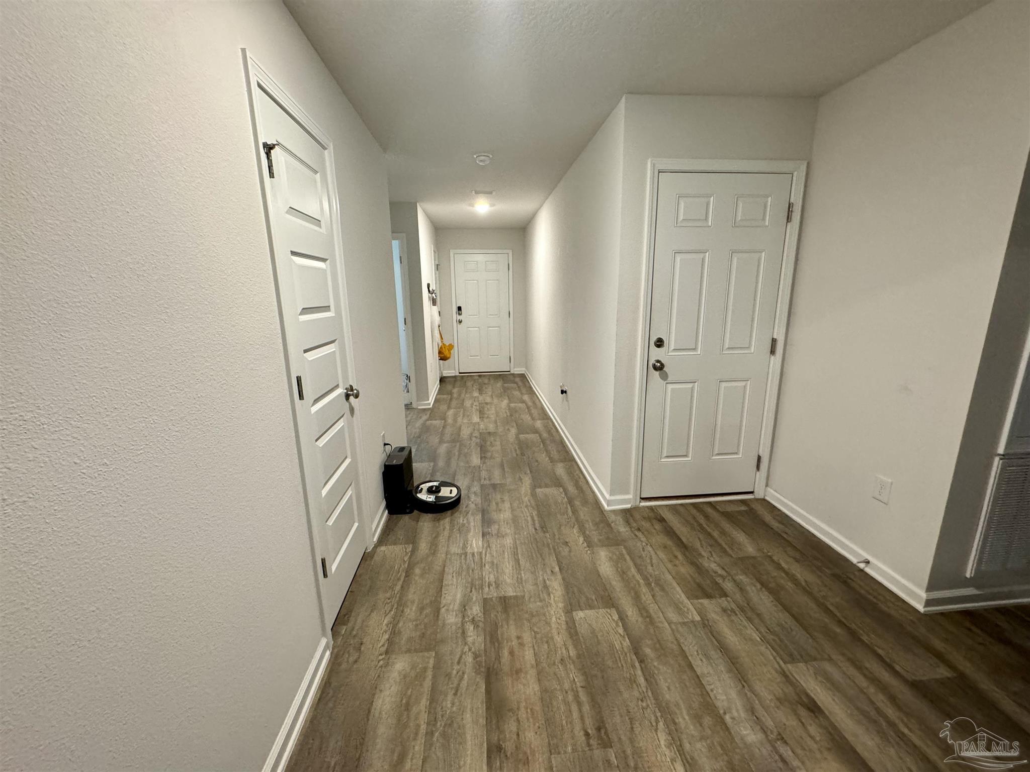 5645 Guinevere Lane Milton, FL 32583 - Photo 3 of 24 a view of a room with wooden floor