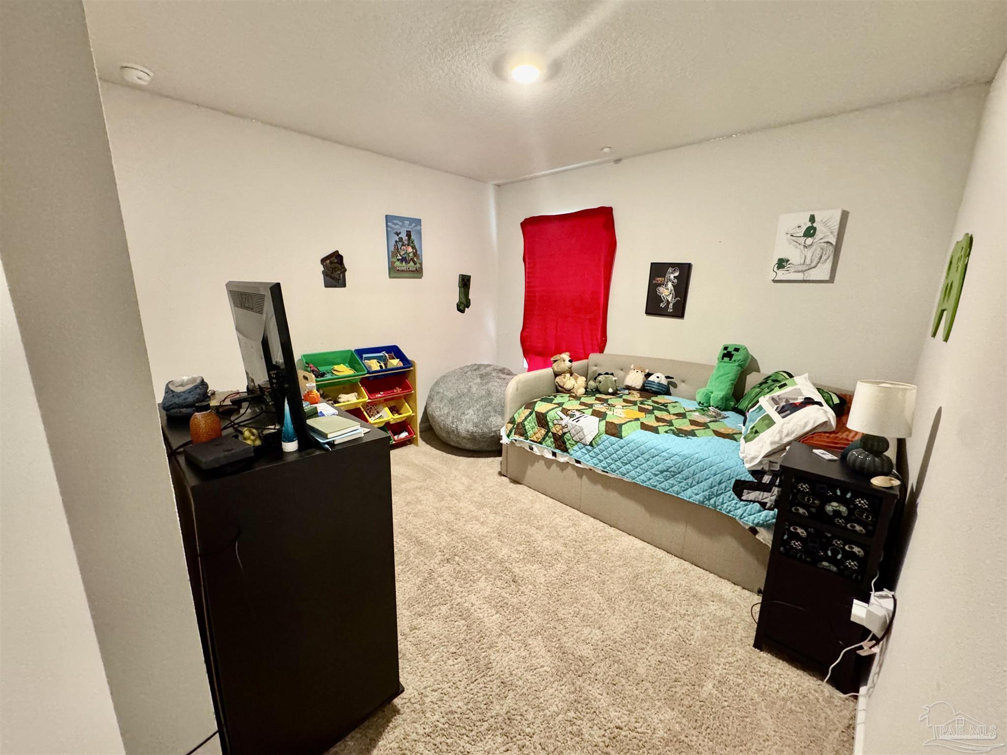 5645 Guinevere Lane Milton, FL 32583 - Photo 7 of 24 a living room with furniture and a potted plant