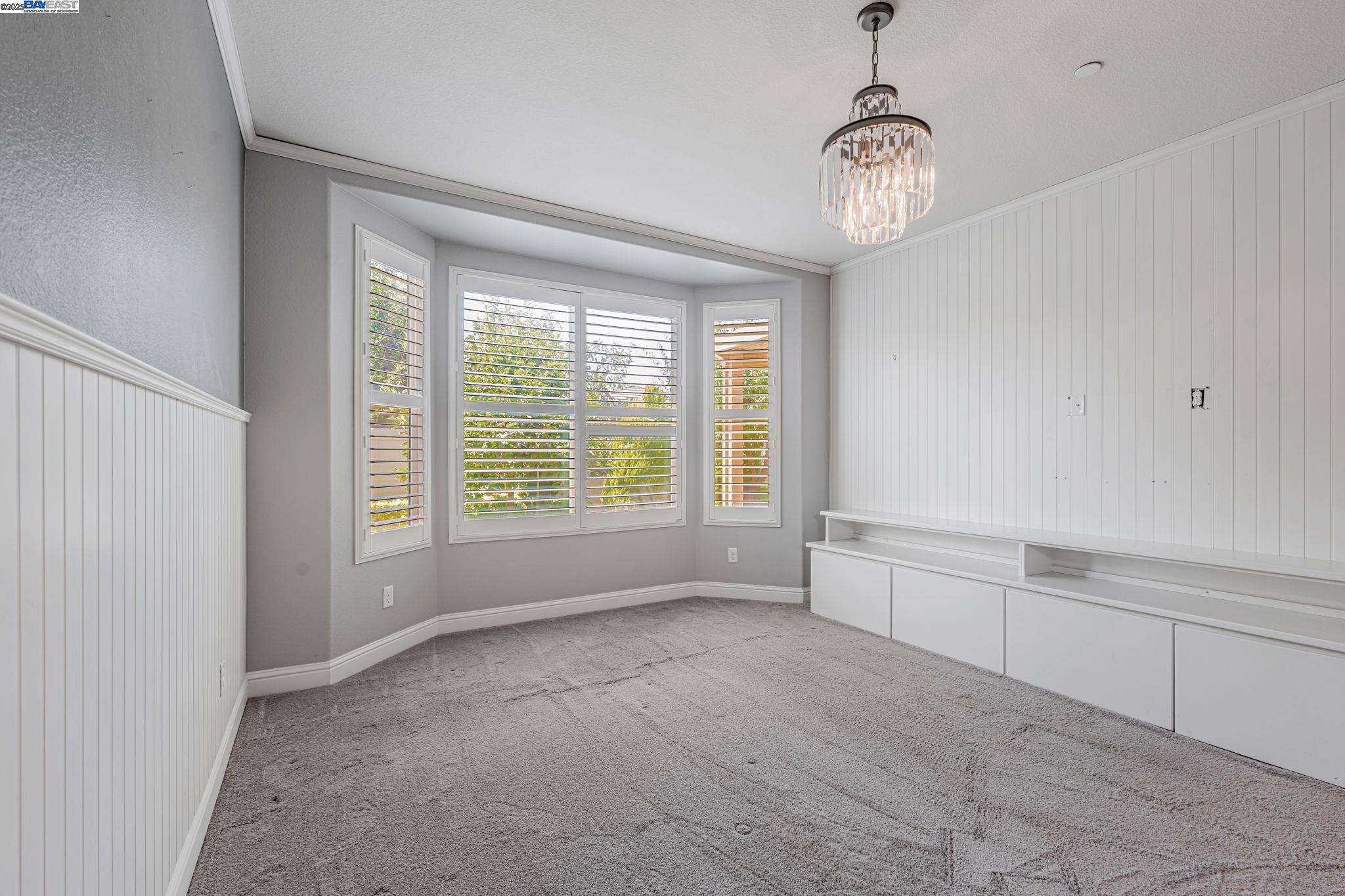 2491 Redbud Way Manteca, CA 95336 - Photo 12 of 27 a view of an empty room with a window