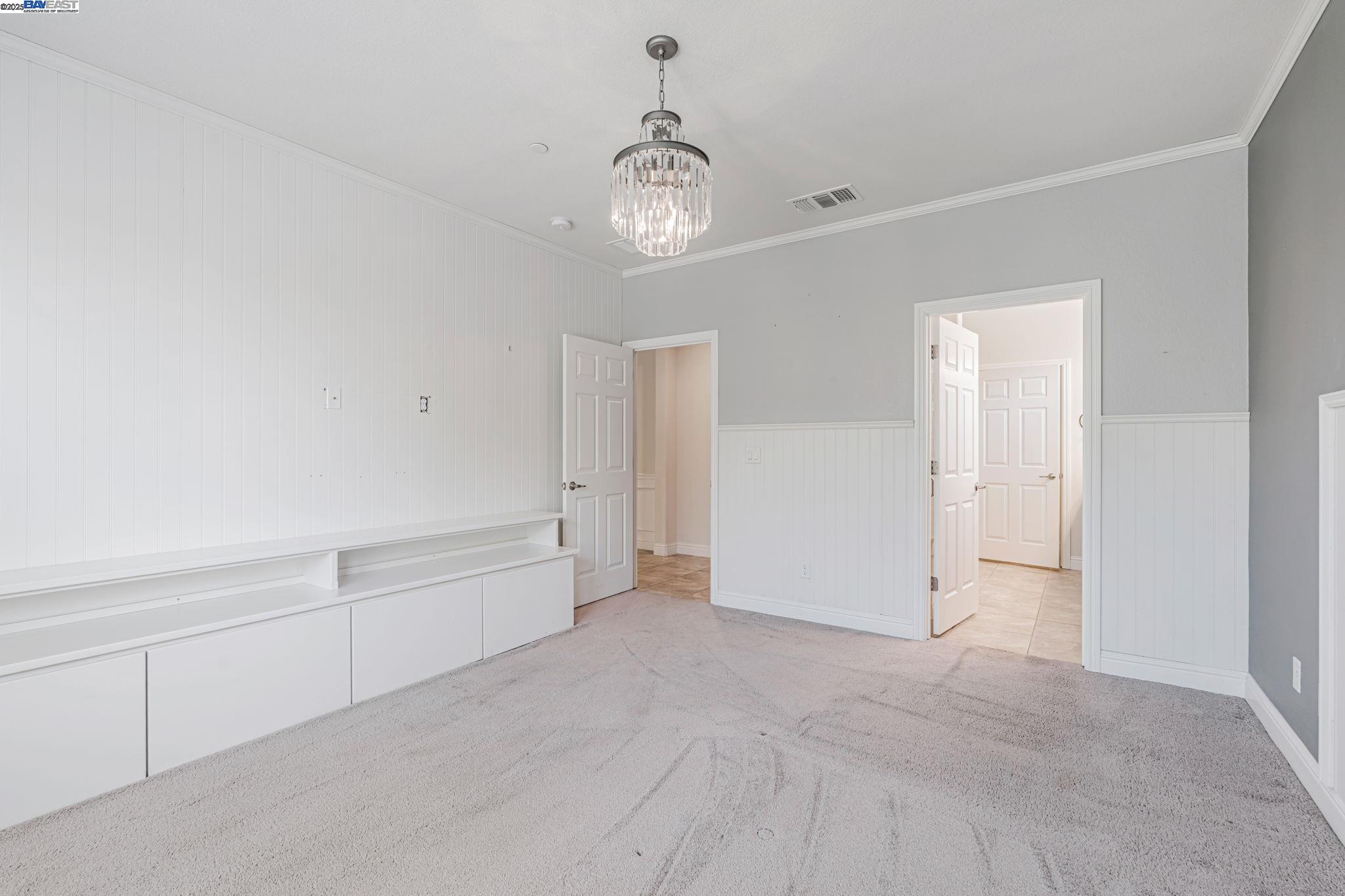 2491 Redbud Way Manteca, CA 95336 - Photo 13 of 27 wooden floor in an empty room with a window