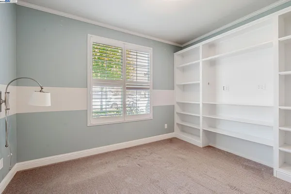a room with cabinets and a window