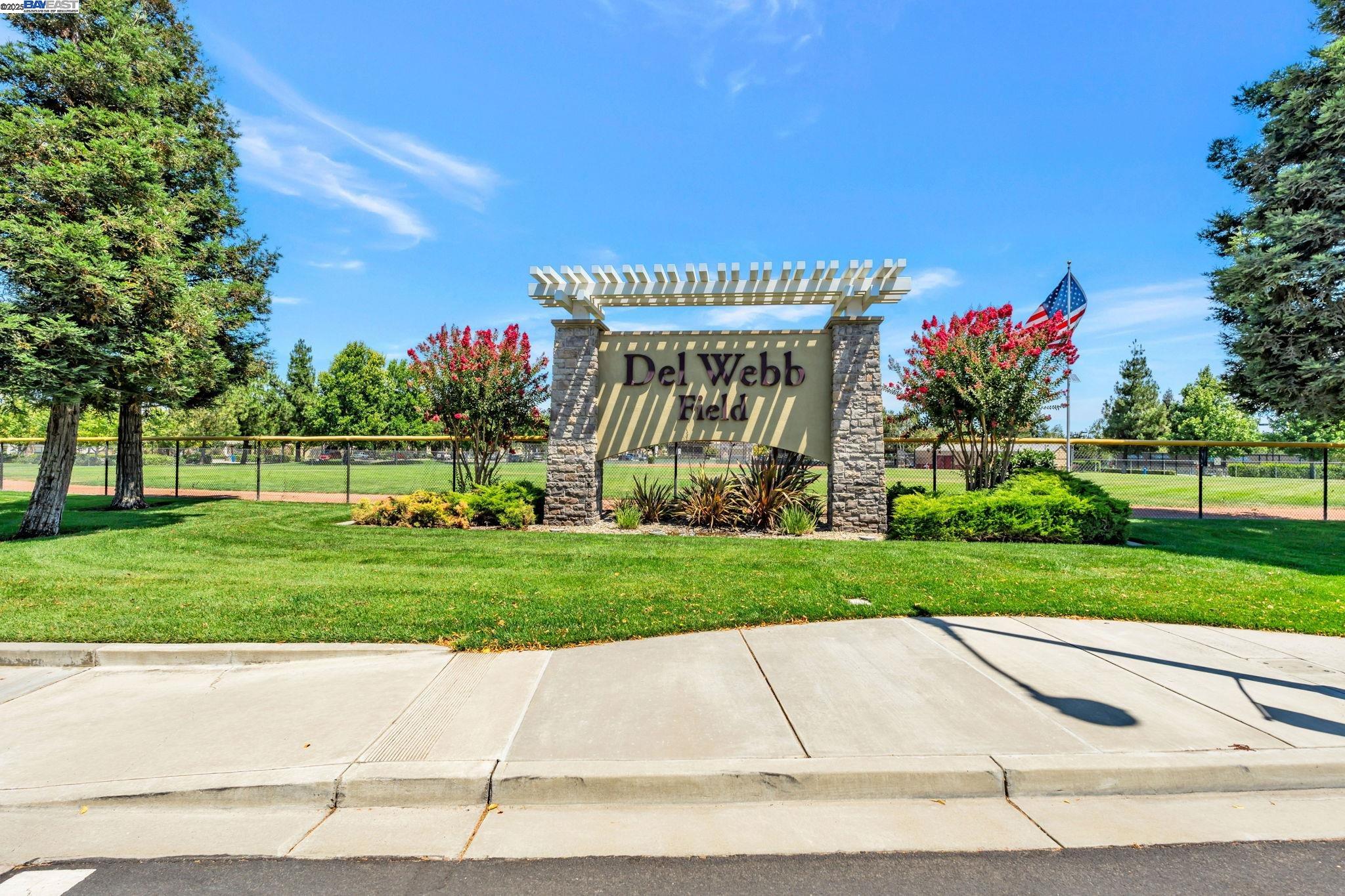 2491 Redbud Way Manteca, CA 95336 - Photo 22 of 27 a front view of a house with a yard and a garage