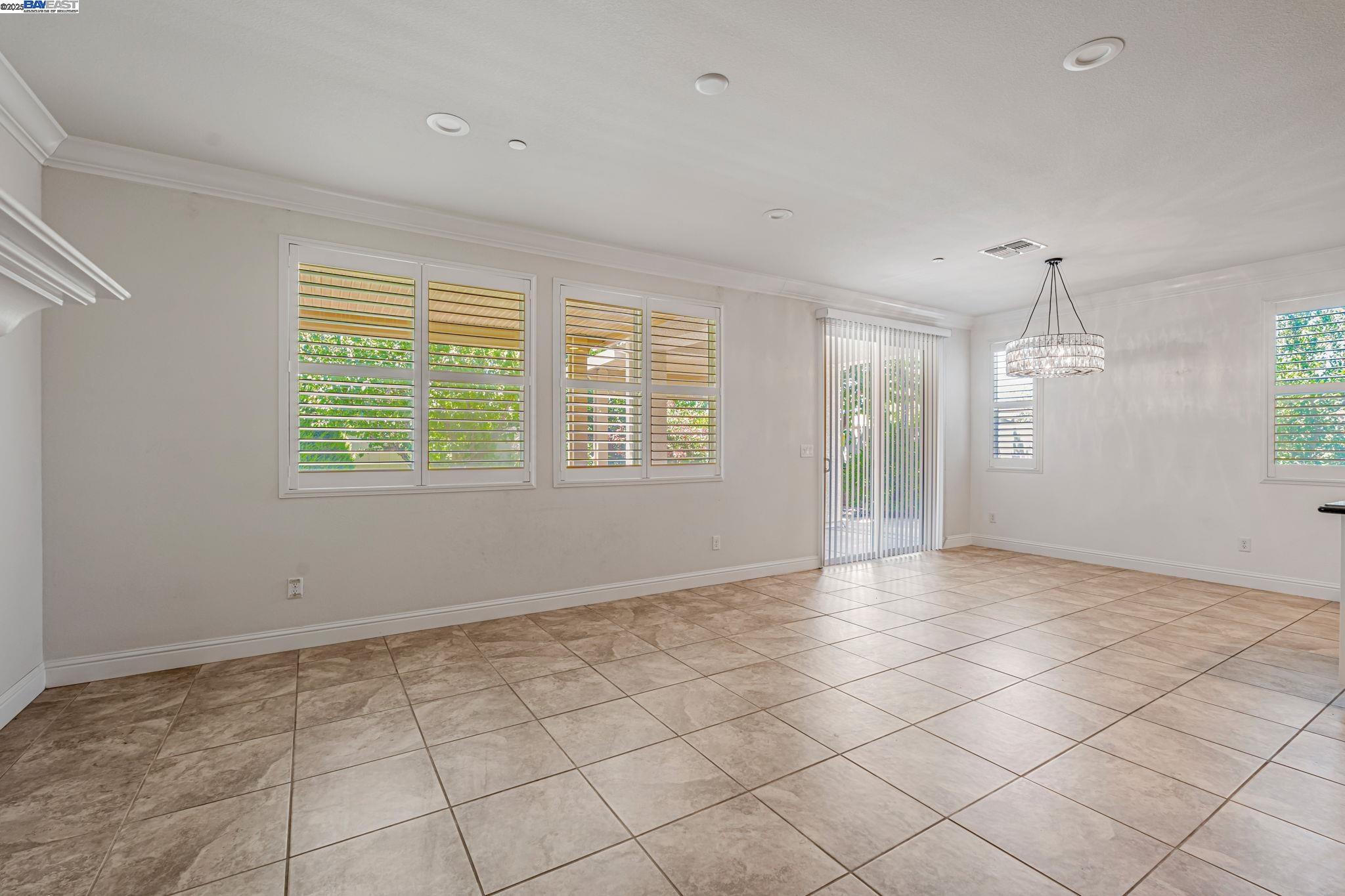 2491 Redbud Way Manteca, CA 95336 - Photo 5 of 27 a view of an empty room with a window