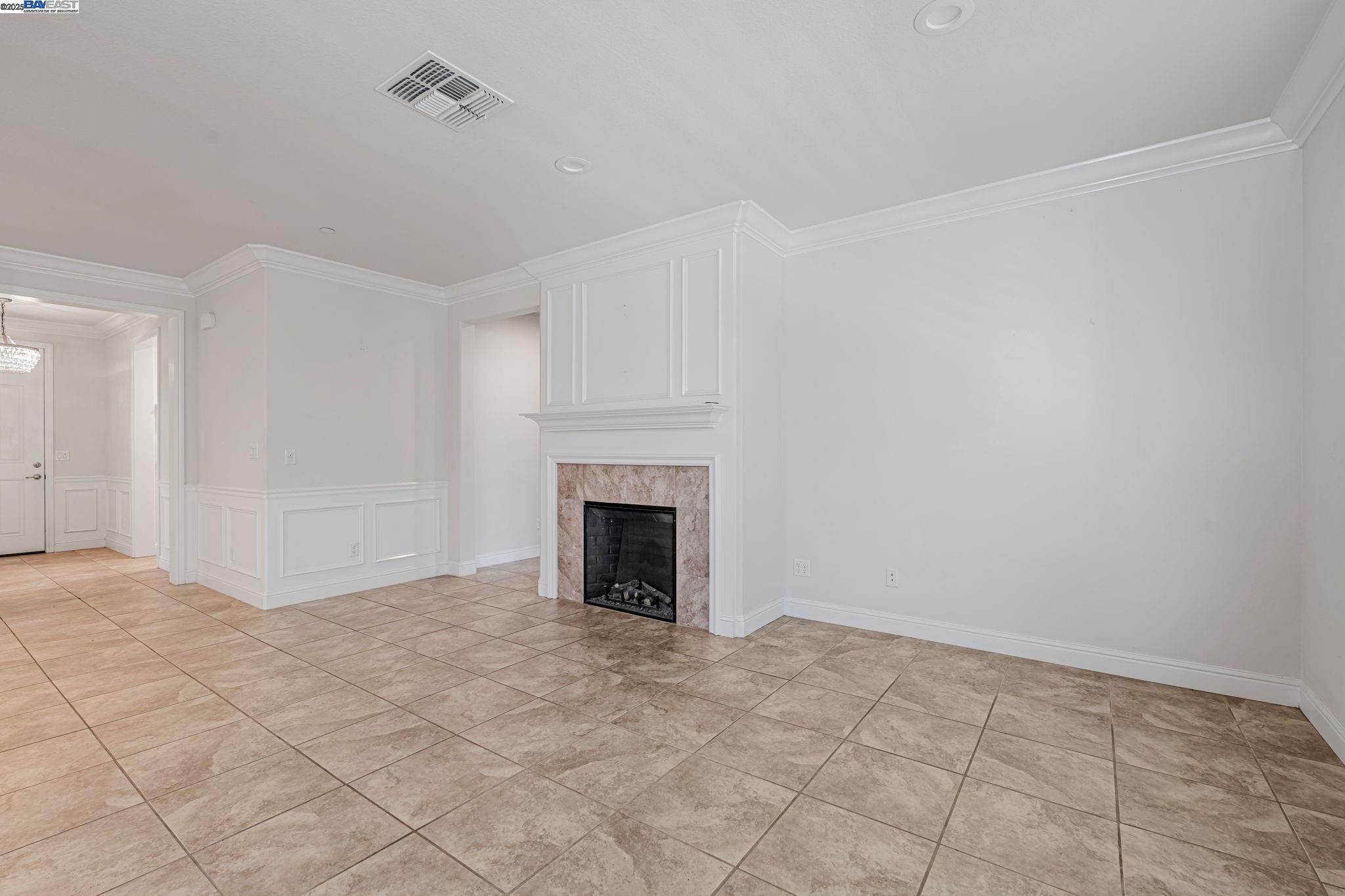 2491 Redbud Way Manteca, CA 95336 - Photo 7 of 27 a view of an empty room with a fireplace
