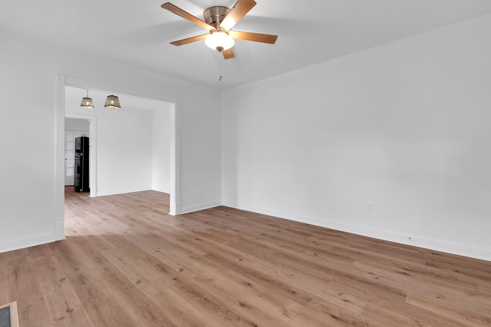 815 North High Street Winchester, TN 37398 - Photo 12 of 24 an empty room with wooden floor fan and windows