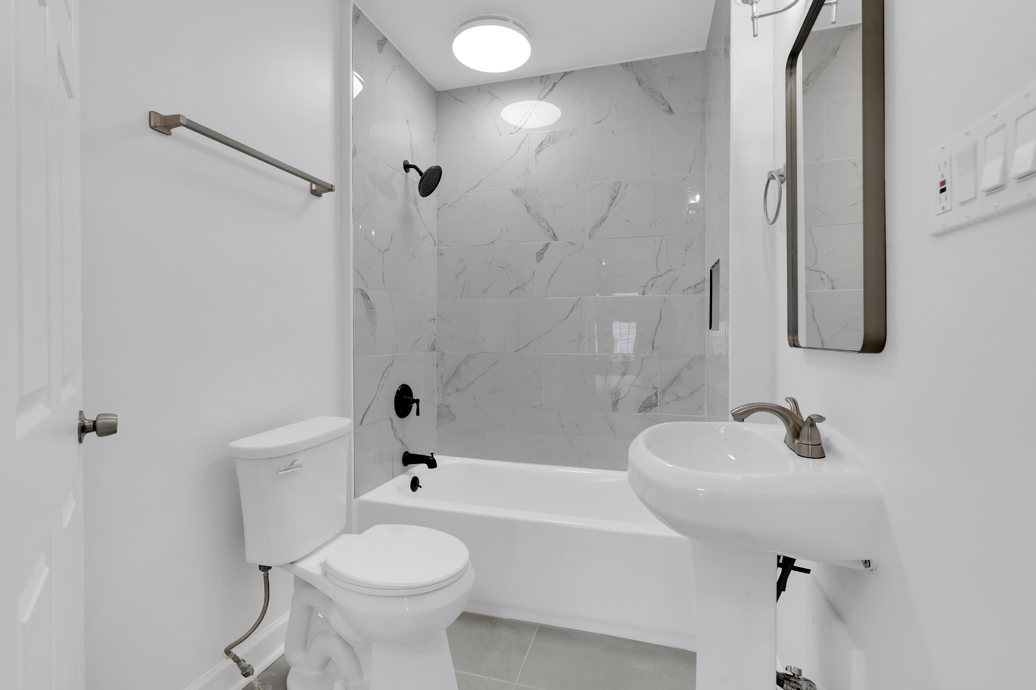 815 North High Street Winchester, TN 37398 - Photo 13 of 24 a bathroom with a sink a toilet and shower