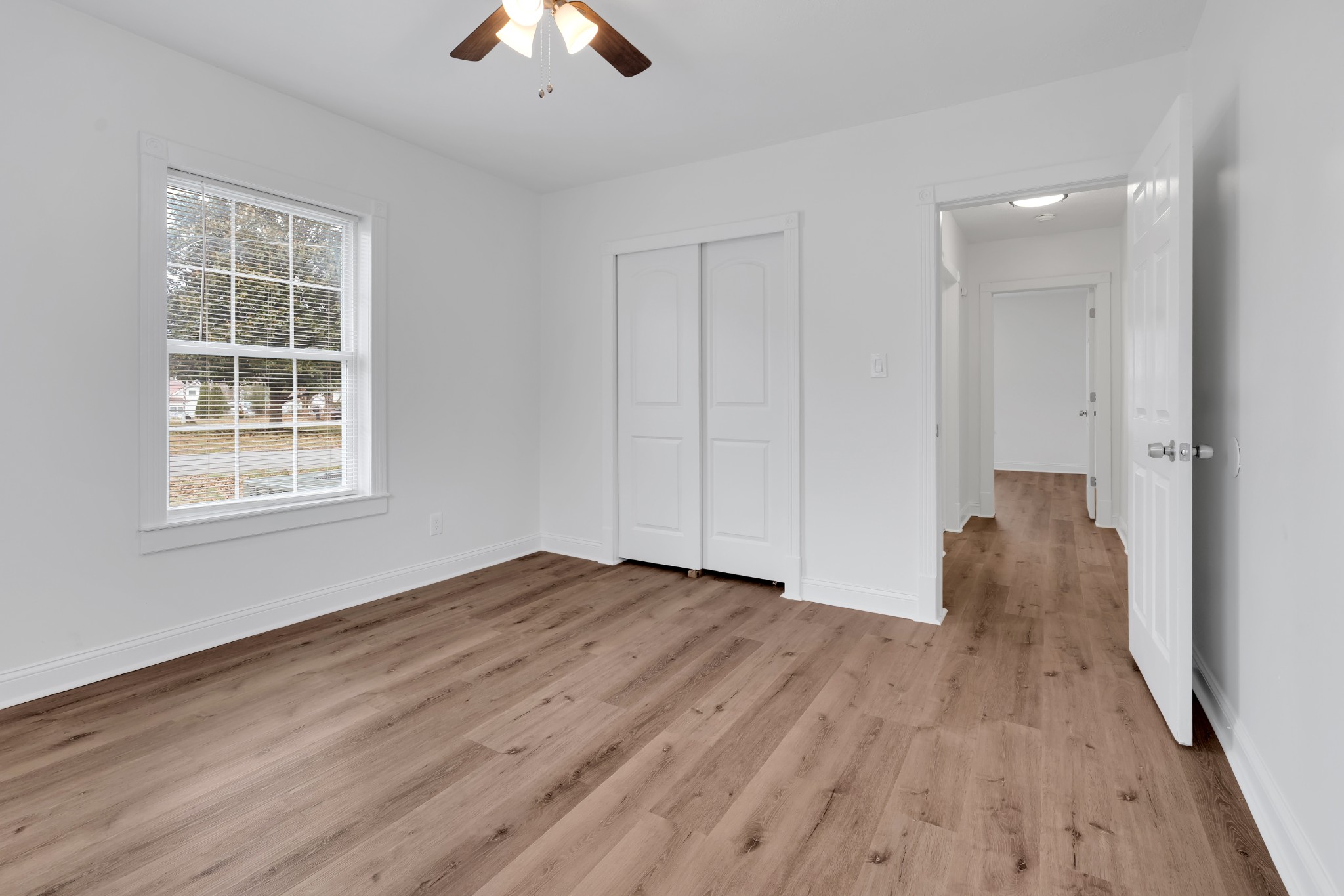 815 North High Street Winchester, TN 37398 - Photo 15 of 24 wooden floor in an empty room with a window