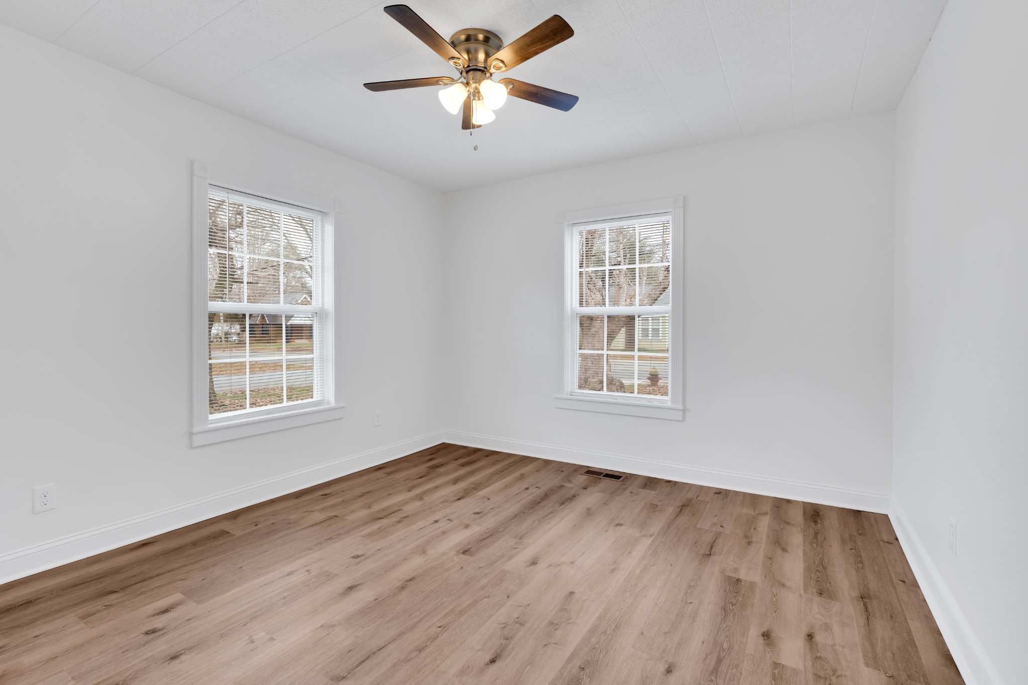815 North High Street Winchester, TN 37398 - Photo 17 of 24 a view of an empty room with window and wooden floor