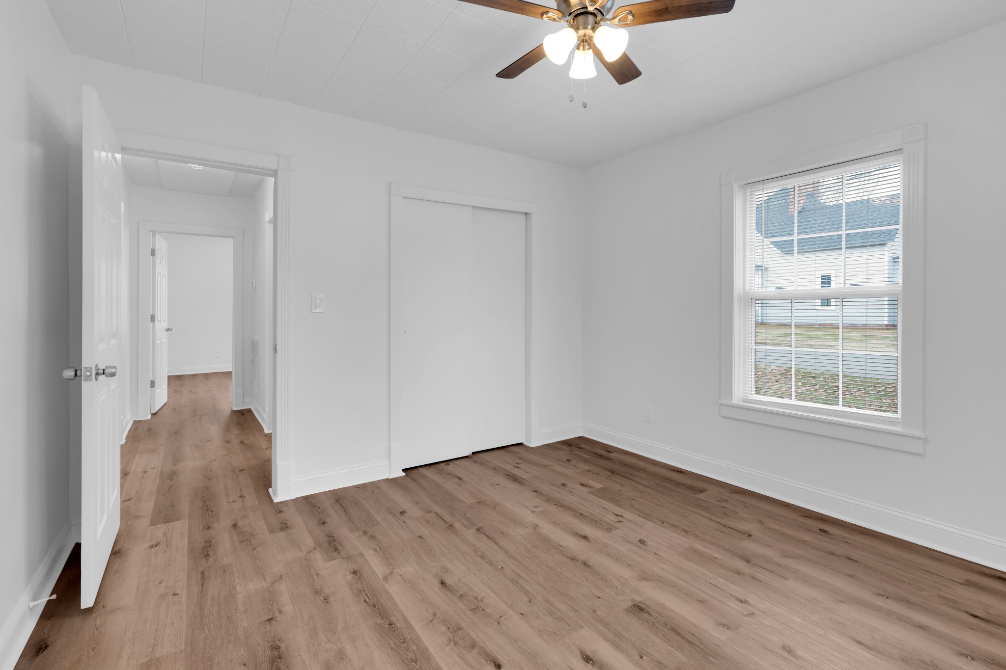 815 North High Street Winchester, TN 37398 - Photo 18 of 24 a view of an empty room with wooden floor and a window