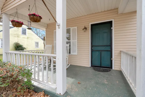 a view of porch with a small yard
