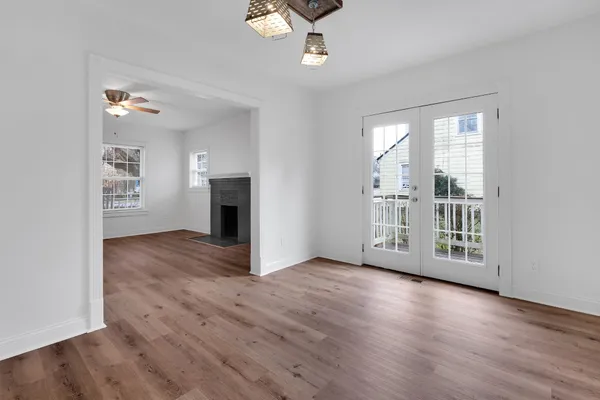 wooden floor in an empty room with a window