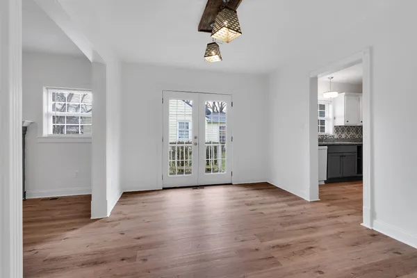 wooden floor in an empty room with a window and wooden floor