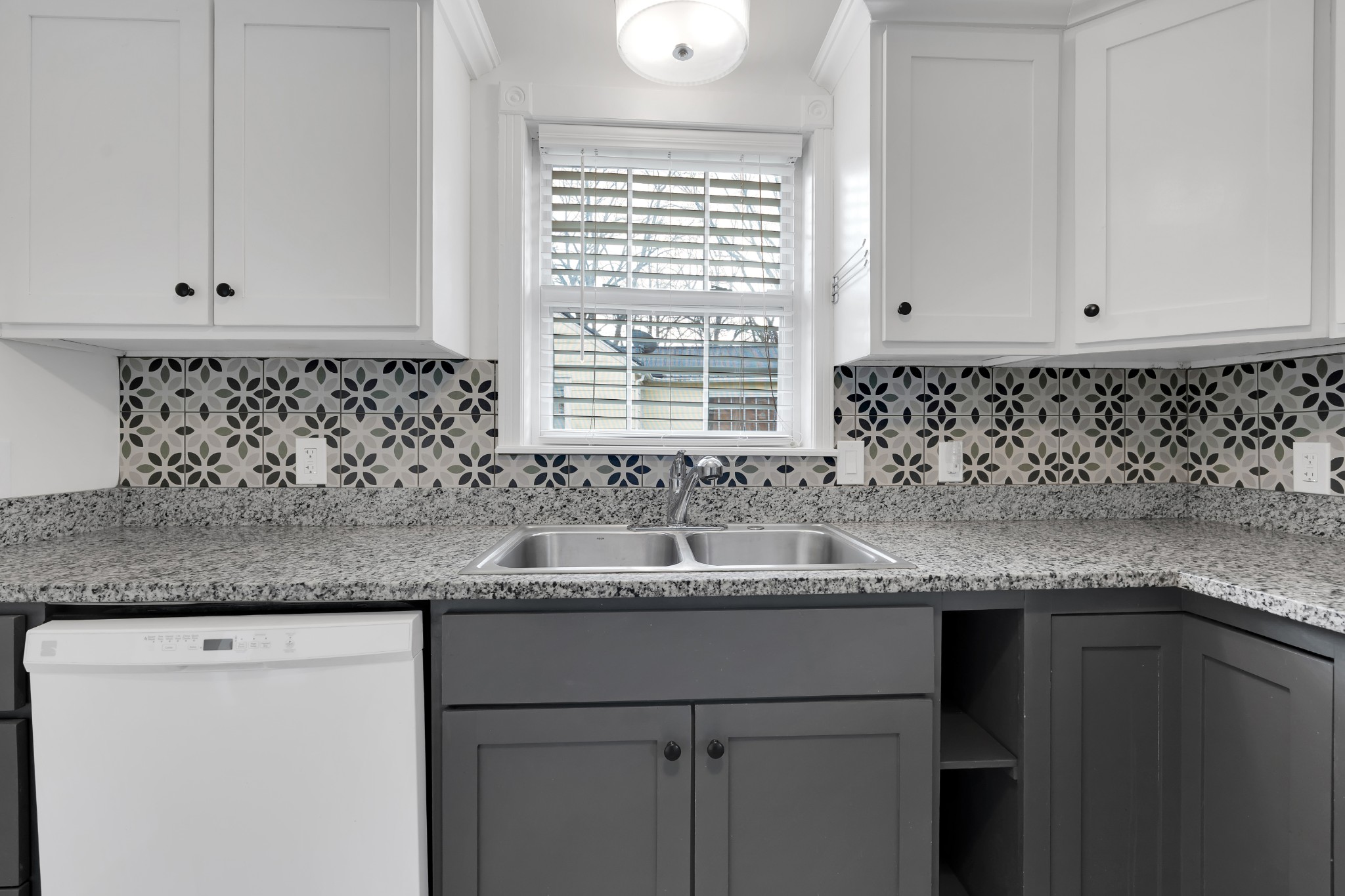 815 North High Street Winchester, TN 37398 - Photo 10 of 24 a kitchen with granite countertop a sink and a window