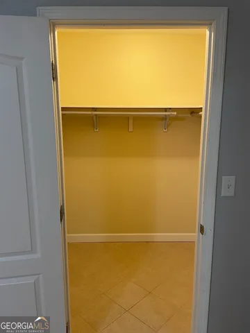 a bathroom with a toilet a sink and a window